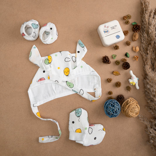 MUSLIN-CAP-MITTEN-BOOTIES-FLOTING SMILES